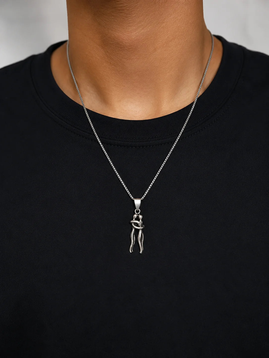 Silver embrace pendant